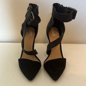 Black Joes heels with zipper and buckle details. Size 7